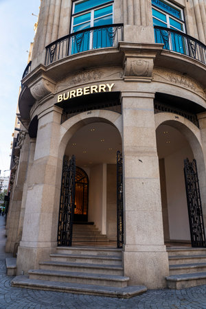 Porto, Portugal - November 23, 2023: Sign of Burberry, luxury clothing store in Dos Aliados avenue,...