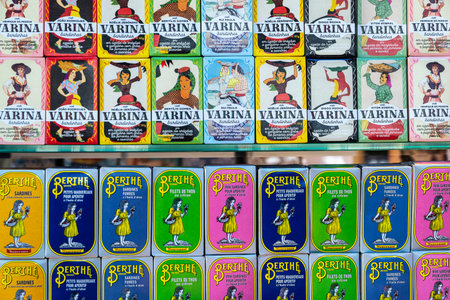 Porto, Portugal - November 23, 2023: Cans of preserves of sardines in a gourmet shop in Bolhao...