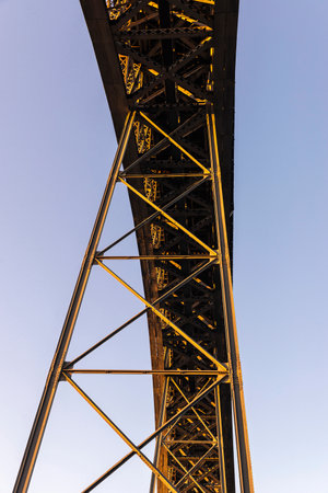 Abstract view of the Dom Luis I bridge over the Douro river at sunset in Porto or Porto, Portugal