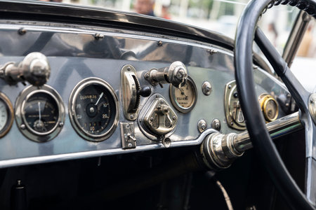 Barcelona, Spain - April 6, 2024: Steering wheel and dashboard of an old retro car from the 1920s of...
