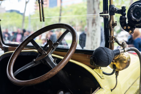 Steering wheel and dashboard of an old retro car from the 1920s parked on a street in Barcelona, Catalonia, Spainの写真素材
