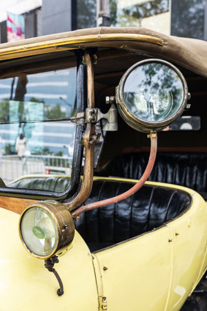 Headlight of an old retro car from the 1920s parked on a street in Barcelona, Catalonia, Spainの写真素材