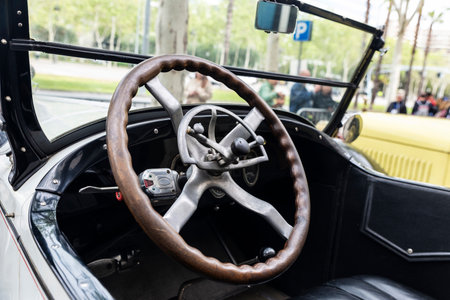 Steering wheel and dashboard of an old retro car from the 1920s parked on a street in Barcelona, Catalonia, Spainの写真素材