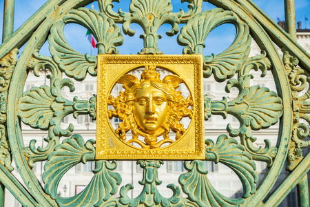 Railing of the Palazzo Reale or Royal Palace that separates Piazzetta Reale from Piazza Castello. with a head of Medusa in Turin or Torino, Piedmont, Italyの写真素材