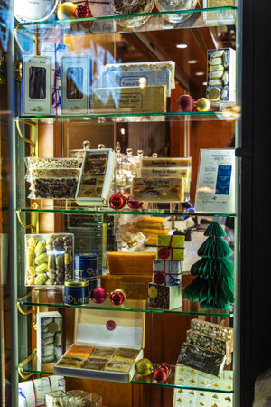 Barcelona, Spain - November 25, 2025: Display of a candy shop specialized in nougat or turron with Christmas ornament in Barcelona, Catalonia, Spainのeditorial素材