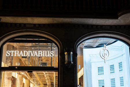 Barcelona, Spain - November 25, 2025: Sign of a Stradivarius clothing store at night in Passeig de Gracia, a shopping street in Barcelona, Catalonia, Spainのeditorial素材