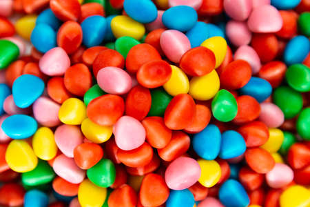 zenithal view of gummy sweets. red, yellow, green, blue and pink colors.