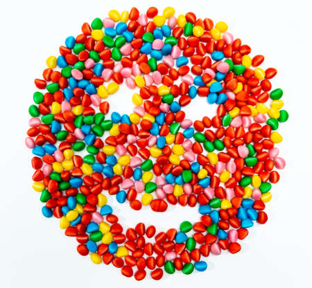 zenithal view, bird's eye view. gummy candies in the shape of a smiling face. red, yellow, green, blue and pink colors.の写真素材