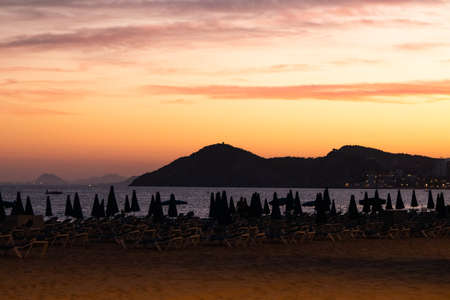 sunset with clouds in the sky on the beach of Benidorm (Alicante, Valencia). without peopleの写真素材