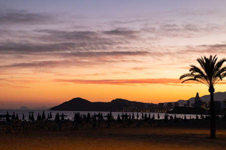 sunset with clouds in the sky on the beach of Benidorm (Alicante, Valencia). without peopleの写真素材
