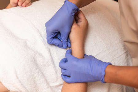 physiotherapist giving treatment with dry needling to patientの写真素材