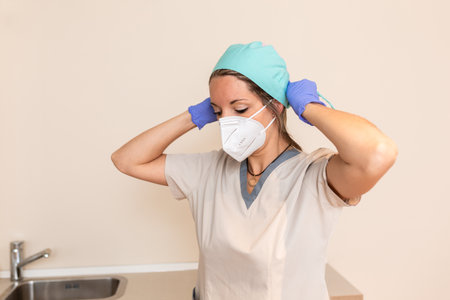 Portrait of female surgeon or nurse wearing protective uniformの写真素材