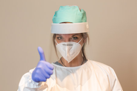 Medical worker in the coronavirus wearing a face shield and protective maskの写真素材