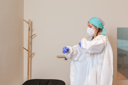 Portrait of female surgeon or nurse wearing protective uniformの写真素材