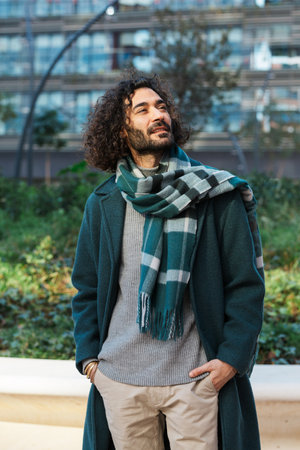 Businessman looking away while standing on the street at financial district.の写真素材