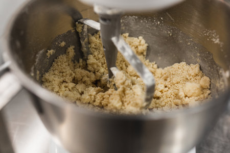 Electric mixer beating mixture for a pastry recipeの写真素材