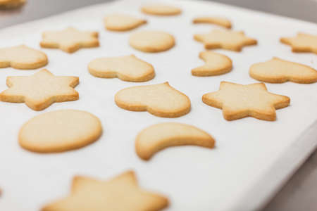 Close-up view of freshly baked cookies of different shapes