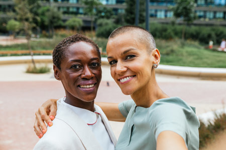 two Businesswomen Taking Selfies in Business Park
