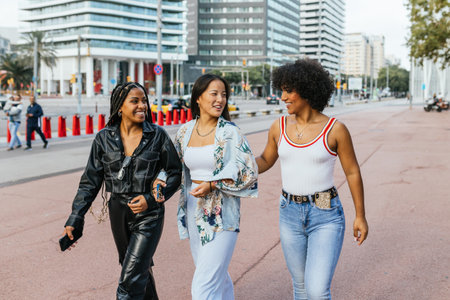Multiracial and transgender friends walking along the cityの写真素材