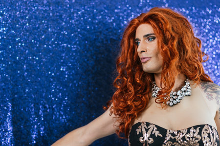 Beauty drag queen on stage with a blue backgroundの写真素材
