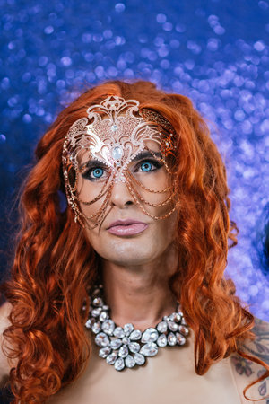 Drag queen wearing a fancy a mask on stageの写真素材