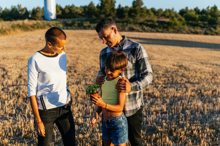 Family spending time together in a field in summer.