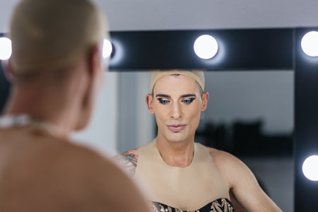 Drag queen artist preparing for performing in the dressing room.の写真素材