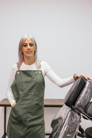 Confident cosmetic tattoo artist in beauty clinicの写真素材