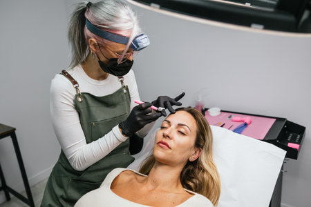 Professional microblading procedure in modern beauty salonの写真素材