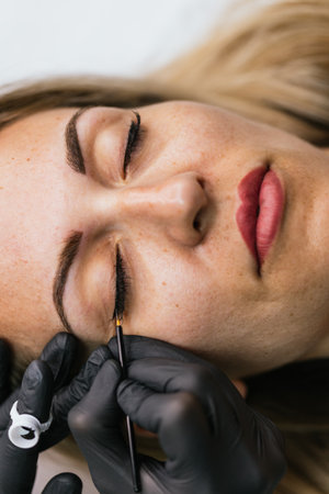 Professional makeup artist applying eyelinerの写真素材