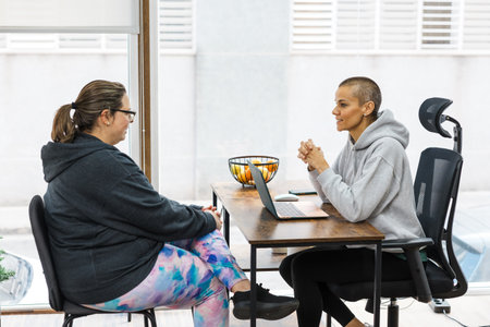 Nutritionist giving advice to client about healthy eating habitsの写真素材
