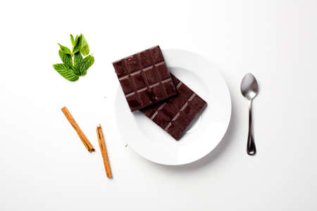 Chocolate bar on a white plateの写真素材