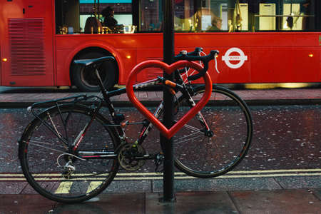 Red heart and a bike tied to a street lamp. Oxford street, Londonのeditorial素材