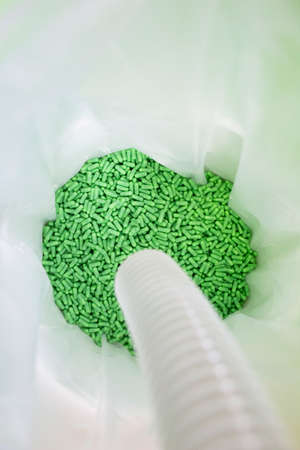 Tank with green capsules