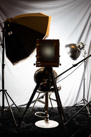 Lighting set in a studio with a large old wooden cameraのeditorial素材