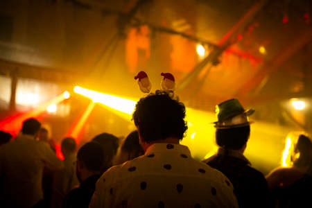 Man with a fancy santa ears in a christmas partyのeditorial素材