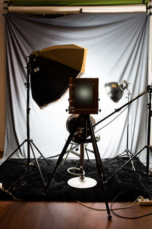 Lighting set in a studio with a large old wooden cameraのeditorial素材