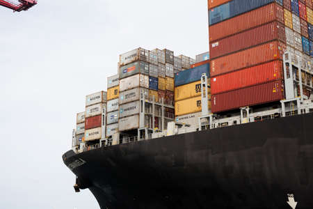 Container ship arriving at Container Terminal, Barcelona harbor. Catalonia, Spain.