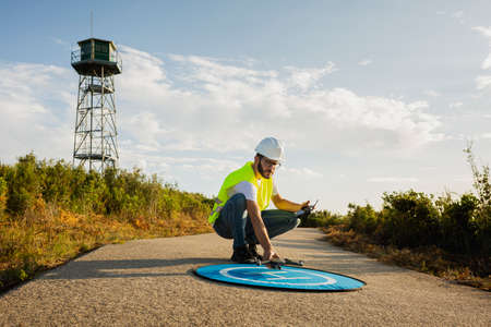 Drone operator piloting a Drone on A Rural Settingの写真素材