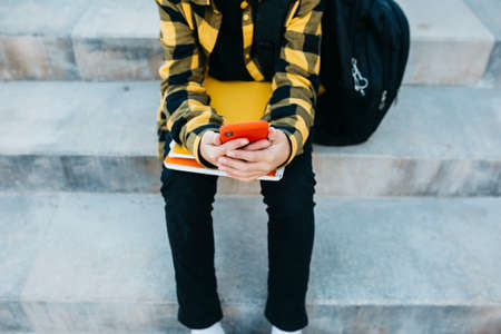 Portrait of a Teenager boy on an old metal bridge on his way to school