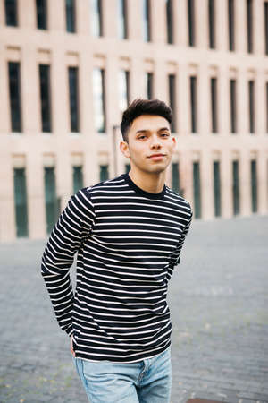 Portrait of a young male walking on the streetの写真素材