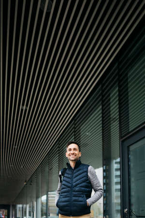 Portrait of a smiling man in his thirties on the street