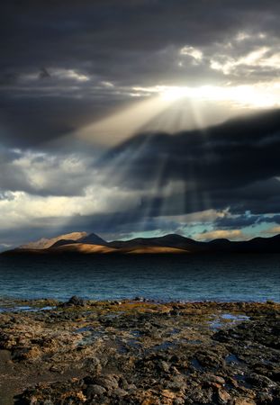 Landscape . The sun's rays break the dark cloudsの写真素材