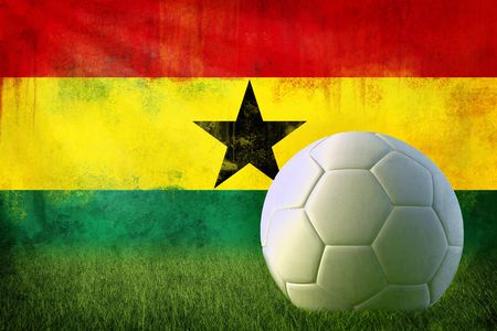 Grunge Ghana flag on wall and soccer ballの写真素材