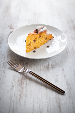 Slice of cake to the pumpkin on dishの写真素材