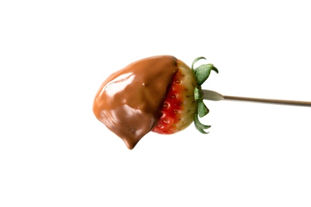 Strawberries with chocolate and icing sugar in a dishの写真素材