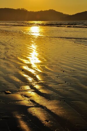 the beach at sunset with low tideの写真素材