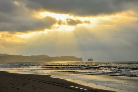 A stormy sunset on the beach.の写真素材