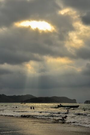 A stormy sunset on the beach.の写真素材