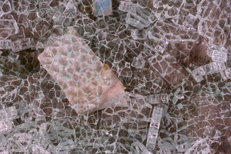 A close up of Shattered glass in a wheelbarrowの写真素材